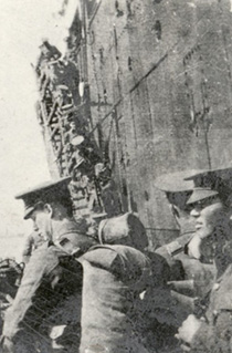 Soldiers boarding longboats.